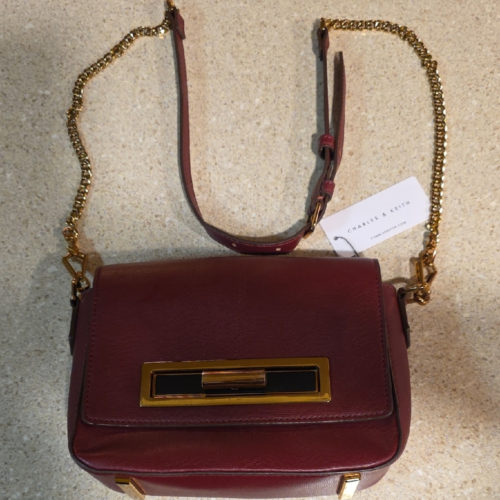 Charles & Keith Wine Red Crossbody Bag with Gold Accents